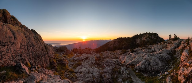 Rocky top of Canadian Mountain Landscape Sunny Sunset Sky Top of Mt Seymour