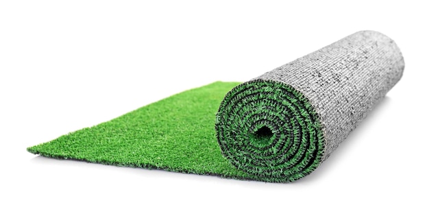 Roll of artificial grass mat on white background