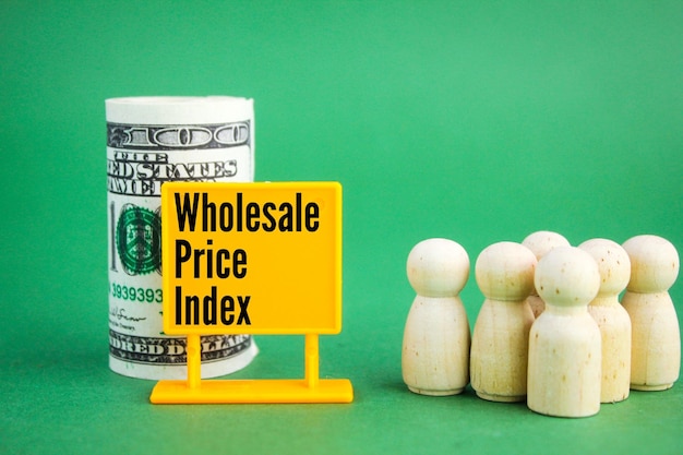 a roll of paper money, a wooden figure with the word wholesale price index or WPI