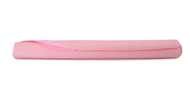 Roll of pink crumpled paper for gift wrapping isolated on white background