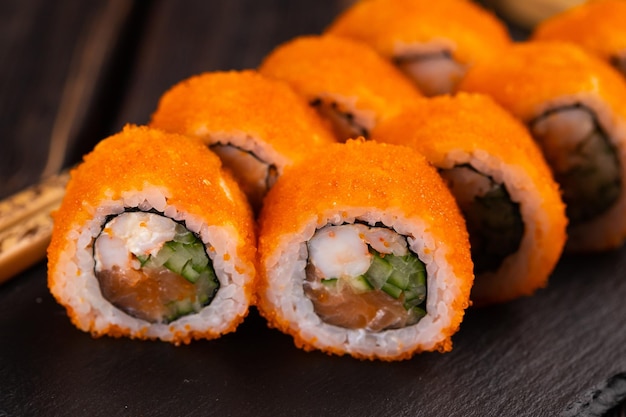 Roll with fish sushi with chopsticks asian food concept