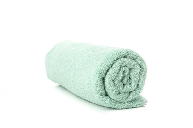 Rolled green towel isolated on white, close up