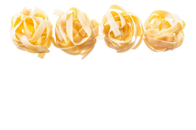 Rolled uncooked pasta isolated on white