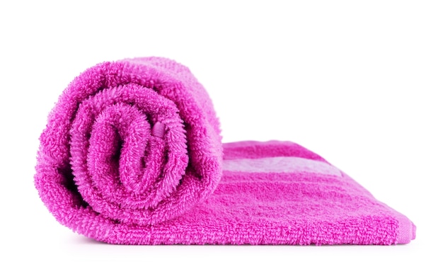 Rolled up pink towel isolated on white