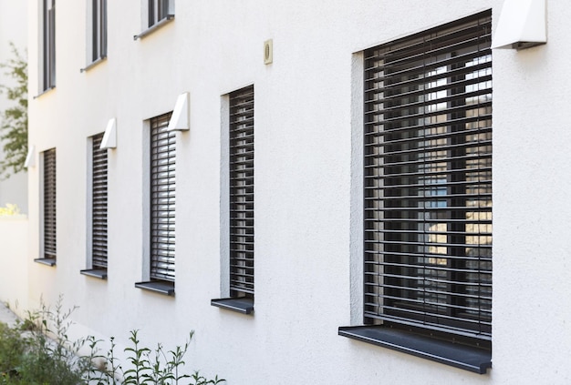 Roller Blind on Modern Windows Outside. External Blinds on windows. Window Roller Blinds Outside.