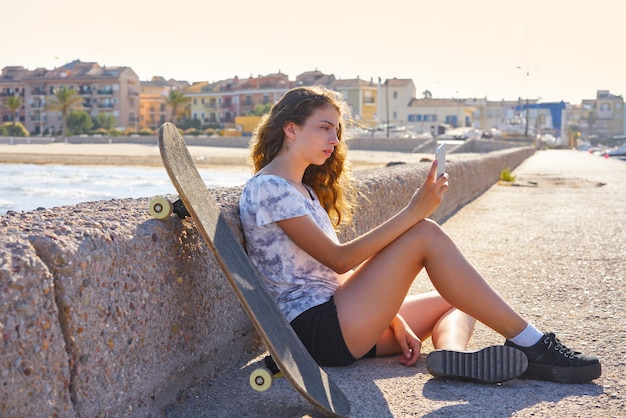 Roller Skate girl with smartphone sitting