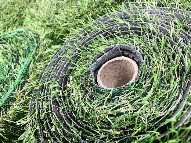 Rolls of artificial grass floor covering