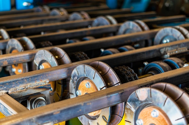 Photo rolls of an industrial machine for cutting metal conveyor line in a factory for processing sheet steel closeup of production equipment