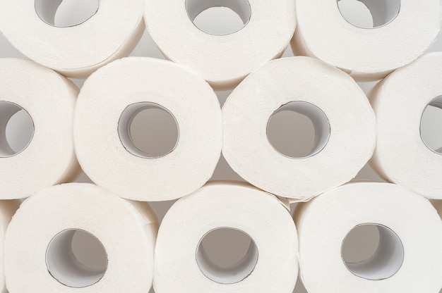 Rolls of toilet paper on white background