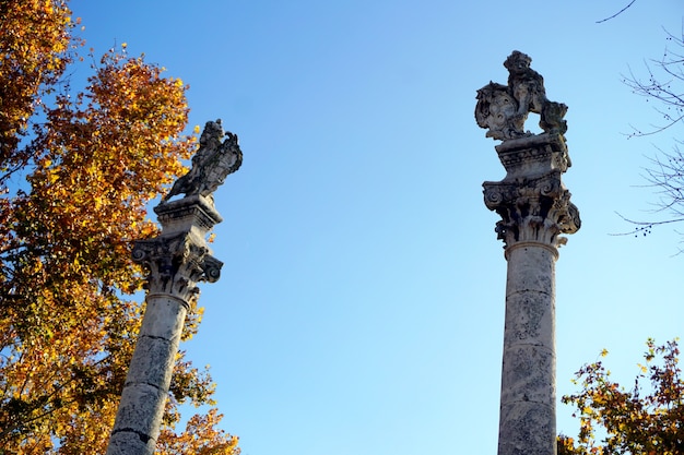 Roman columns with statues of Hercules and Julius Caesar on Alameda de Hercules, Seville, Spain.