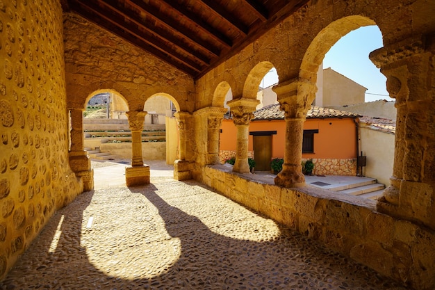 Romanesque cloister with stone arches in the church of San Miguel in the village of San Esteban de Gormaz