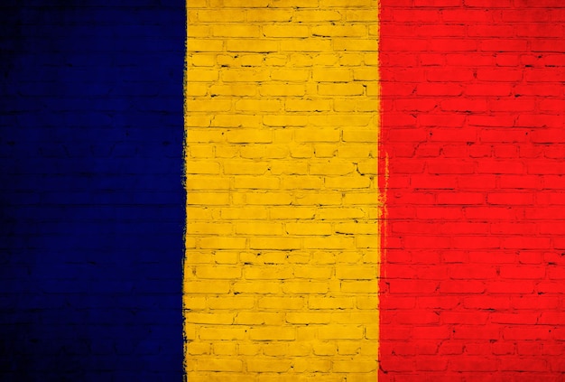 Romania flag painted on brick wall National country flag background photo