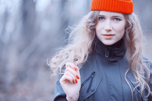 romantic autumn portrait of model, woman, in the autumn seasonal look outside, weather autumn