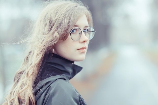 romantic autumn portrait of model, woman, in the autumn seasonal look outside, weather autumn