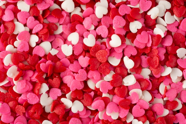 Romantic background, top view of a group of red, white and pink heart shaped candies