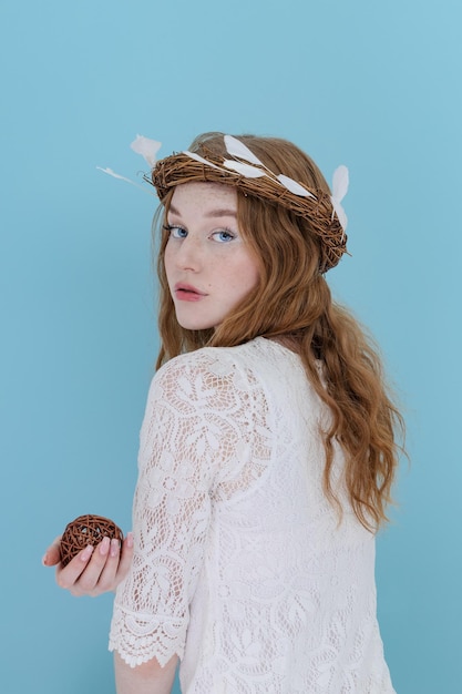 Romantic beautiful woman wearing white feather hair