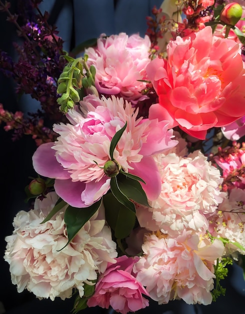 Romantic bouquets of spring flowers with peonies sage foxglove geyhera