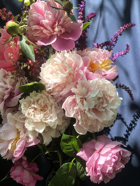 Romantic bouquets of spring flowers with peonies sage foxglove geyhera