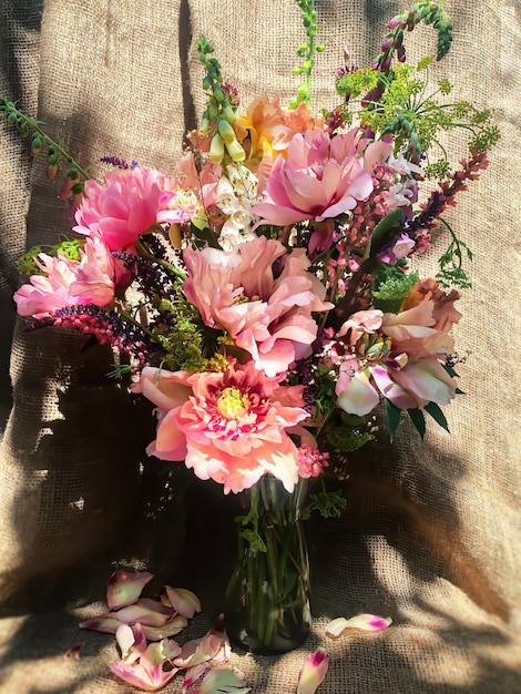 Romantic bouquets of spring flowers with peonies sage foxglove geyhera