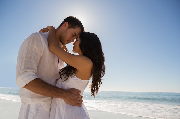 Romantic couple embracing  at the beach