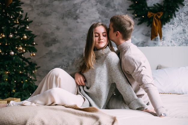 Romantic couple in love at home on Christmas time