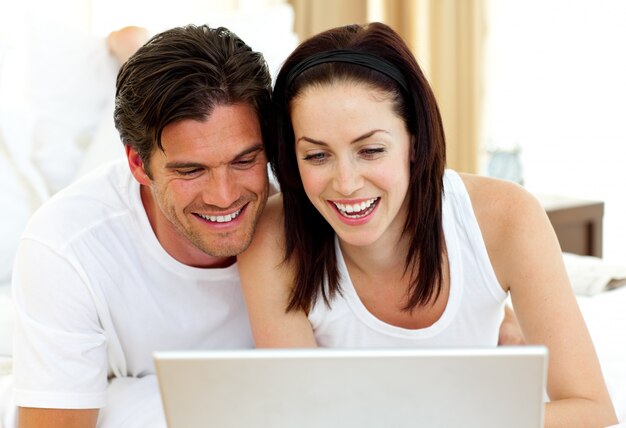 Romantic couple using laptop