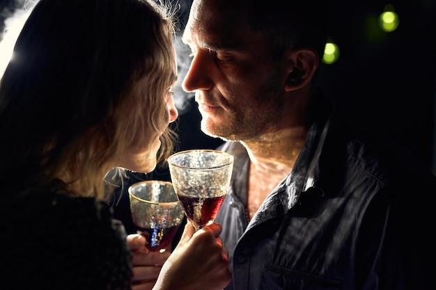 Romantic Couple with Wine Glasses and Candles