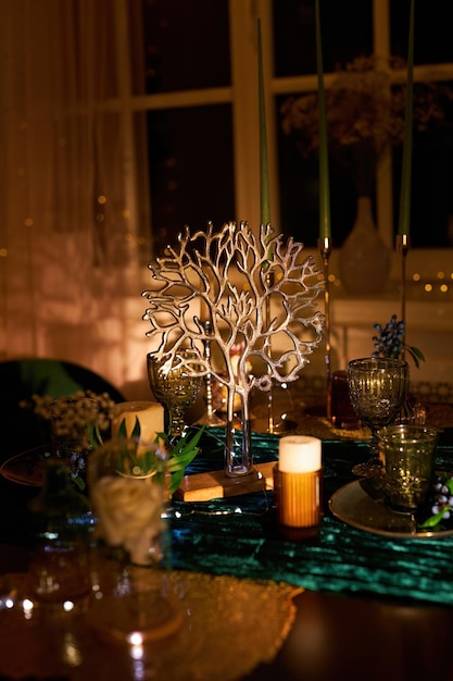 Romantic dinner table setting with festive lights