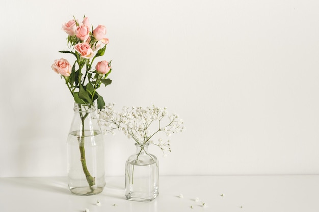 Romantic elegant minimalistic composition with roses and gypsophila flowers. mockup