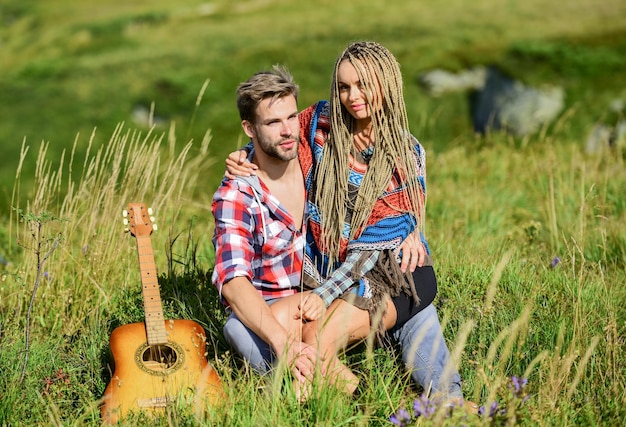 Romantic hike Family hike Boyfriend and girlfriend with guitar in mountains Enjoying each other Summer hike Breathtaking feelings Hiking romance Couple happy cuddling nature background