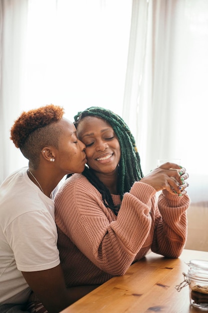 Romantic lesbian couple drinking milk