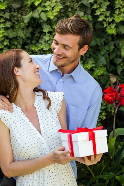 Romantic man giving gift to woman