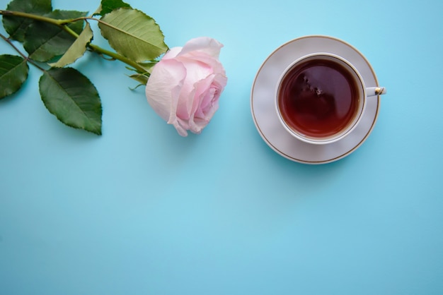 Romantic picture with a rose and a cup of tea