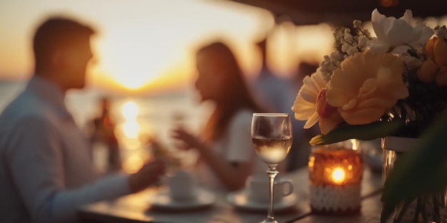 romantic sunset beach caffee ,cup of coffee ,sweet cake and flowers on table ,romantic couple