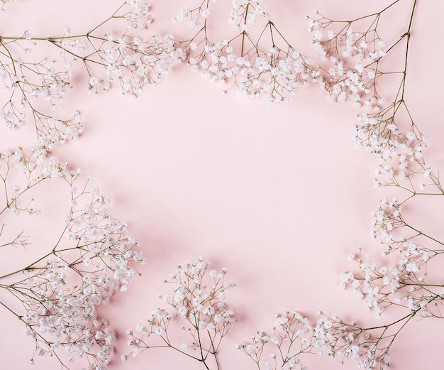 Romantic table setting in pink colors white flowers decor