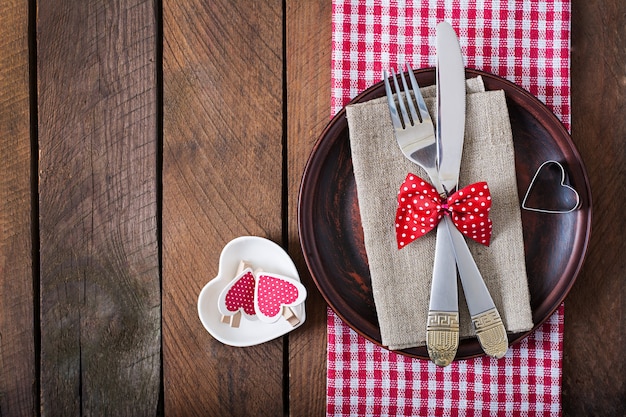 Romantic table setting for Valentines day in a rustic style. Top view