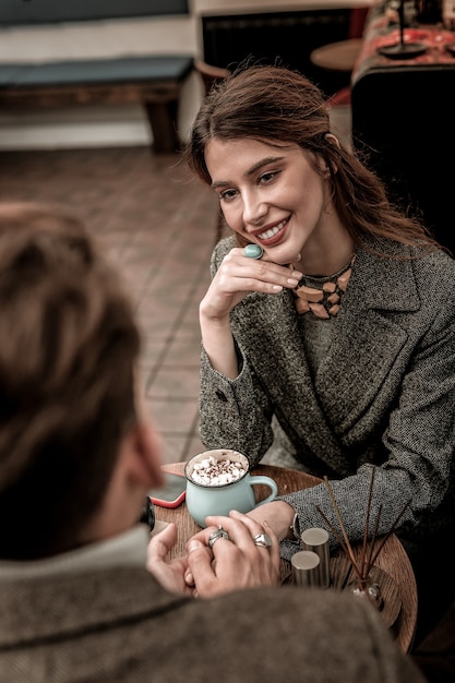 Romantic talk. A beautiful woman looking on her partner during romantic conversation