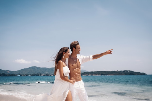 Romantic  young couple  enjoying summer vacation  on the beach.