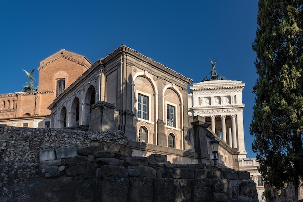 Rome architecture with buildings of various ages and styles in city center at day in sunlight Italy