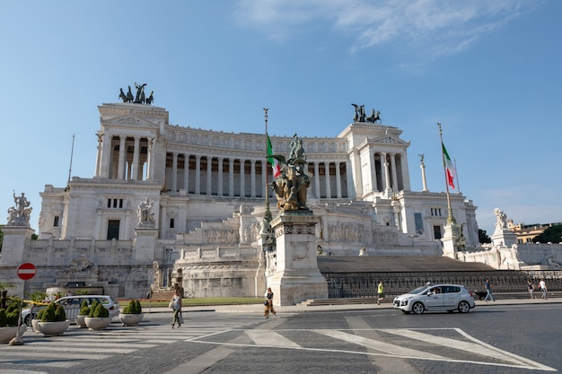 Rome, Italy - June 20, 2018: Panoramic front view of museum the Vittorio Emanuele II Monument also known as the Vittoriano or Altare della Patria at Piazza Venezia in Rome. Summer day and blue sky