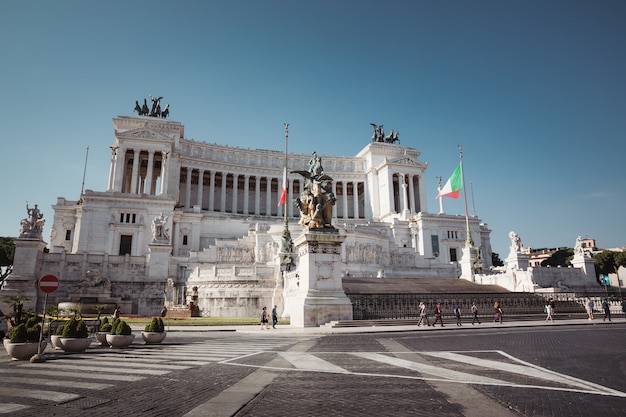 Rome, Italy - June 20, 2018: Panoramic front view of museum the Vittorio Emanuele II Monument also known as the Vittoriano or Altare della Patria at Piazza Venezia in Rome. Summer day and blue sky