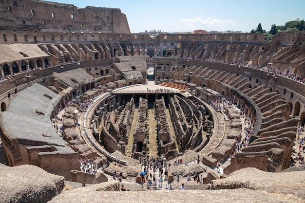 Rome, Italy - June 20, 2018: Panoramic view of interior of Colosseum in Rome. Summer day with blue and sunny sky