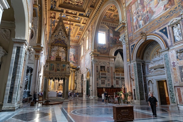 Rome, Italy - June 20, 2018: Panoramic view of interior of Lateran Basilica, also known as Papal Archbasilica of St. John. It is the cathedral church of Rome and serves as seat of the Roman Pontiff