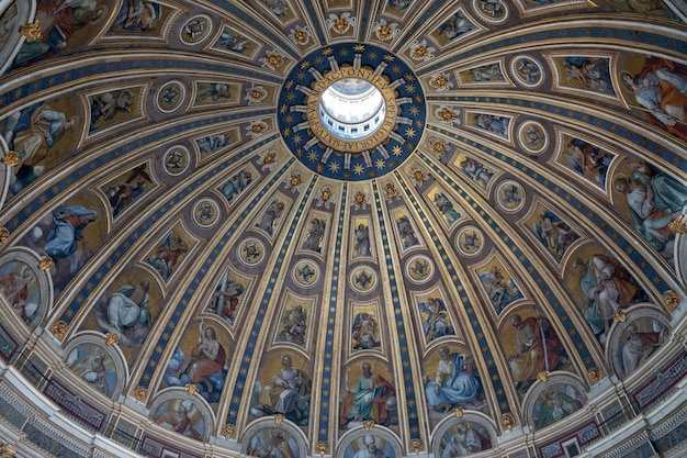 Rome, Italy - June 22, 2018: Interior of cupola of the Papal Basilica of St. Peter (St. Peter's Basilica) in the Vatican