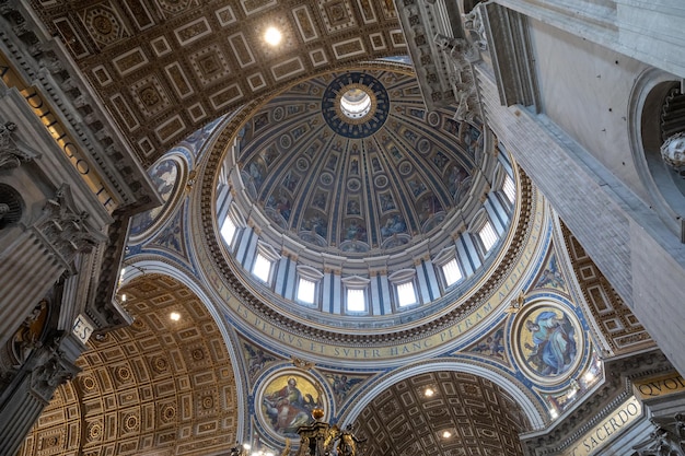 Rome, Italy - June 22, 2018: Panoramic view of interior of Papal Basilica of St. Peter (St. Peter's Basilica). It is an Italian Renaissance church in Vatican City, papal enclave within city of Rome