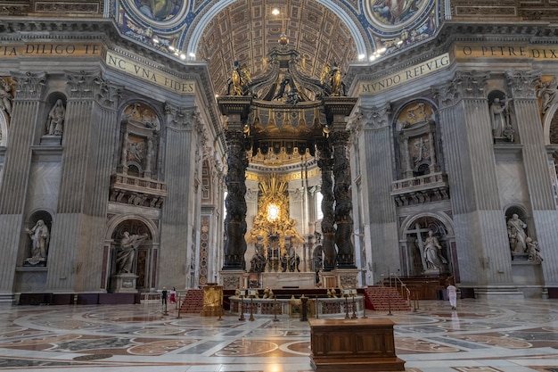 Rome, Italy - June 22, 2018: Panoramic view of interior of Papal Basilica of St. Peter (St. Peter's Basilica). It is an Italian Renaissance church in Vatican City, papal enclave within city of Rome