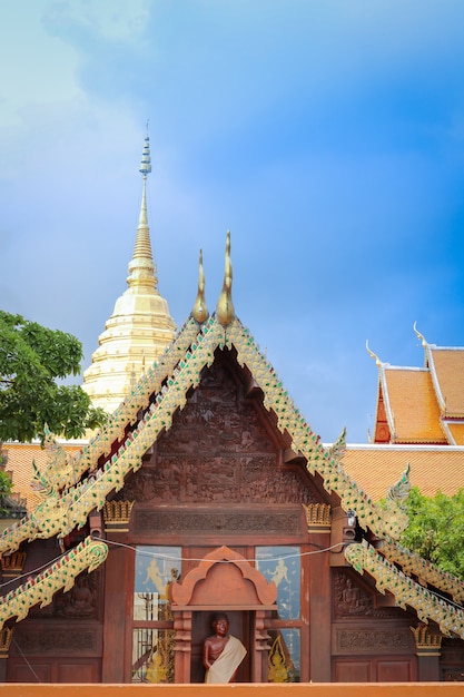 Roof of pavilion at a temple with blue sky Chiangmai Thailand.