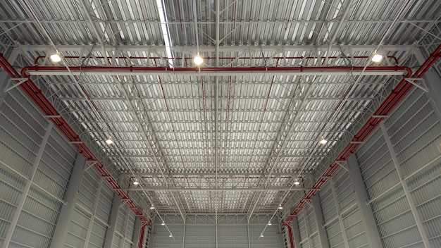 Roof top of industrial background, roof structures of industrial building. Structural of roof industrial. Background and texture of steel structures and light bulb