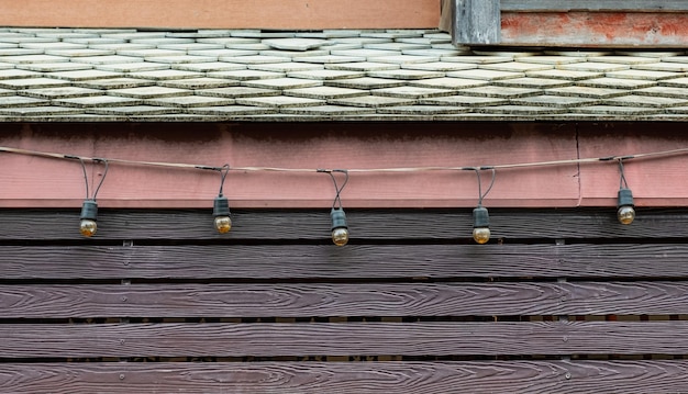 Roof with lamp decorative on wooden wall