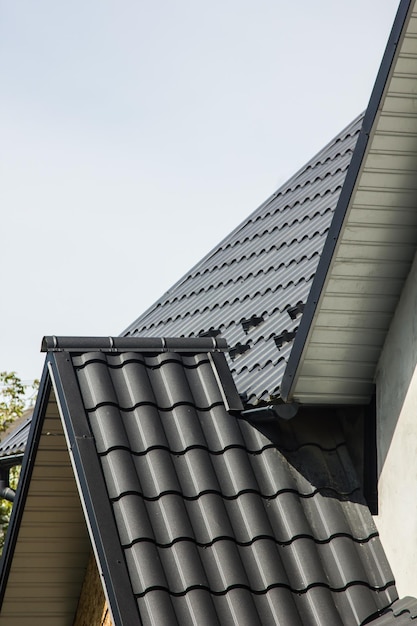 Roofing materials of a roof of the house a metal tile